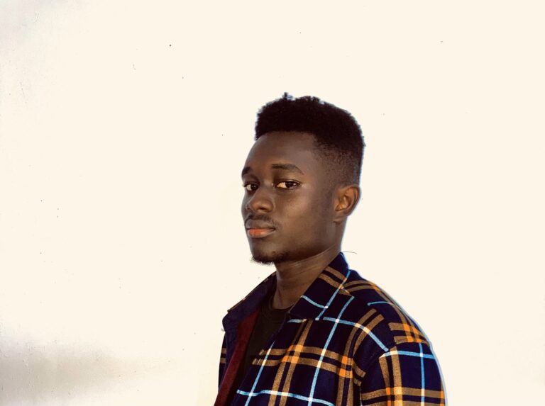 a portrait of Ghanaian blogger, IT professional and scam buster yhang mhany