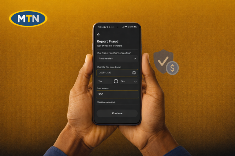 Hands holding a smartphone showing the MTN Ghana app fraud reporting screen for MoMo fraud transfers